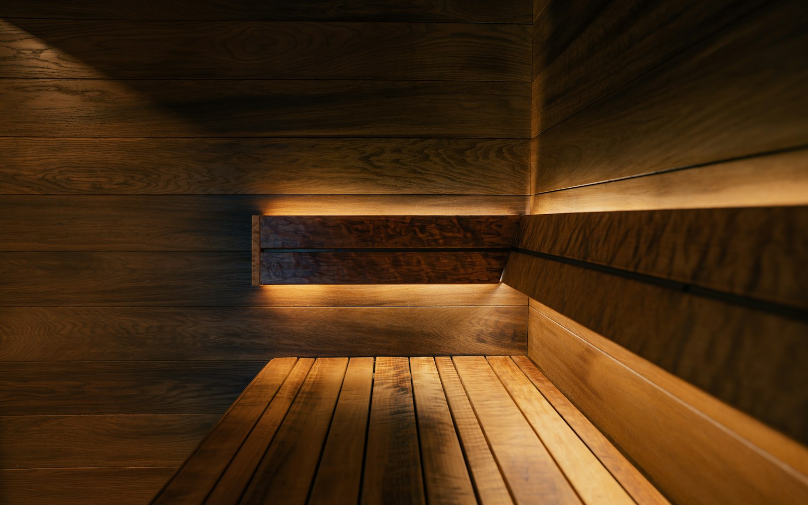 Close-up of the wooden benches and paneled walls inside a sauna